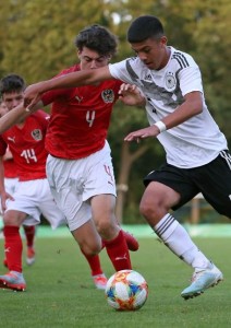 DELMENHORST, GERMANY - SEPTEMBER 05: (L-R) Luca Graf of U16 Austria and Eyuep Aydin of U16 Germany battle for the ball during the international friendly match between U16 Germany and U16 Austria at Staedtisches Stadion an der Duesternortstrasse on September 05, 2019 in Delmenhorst, Germany. (Photo by Cathrin Mueller/Getty Images for DFB)